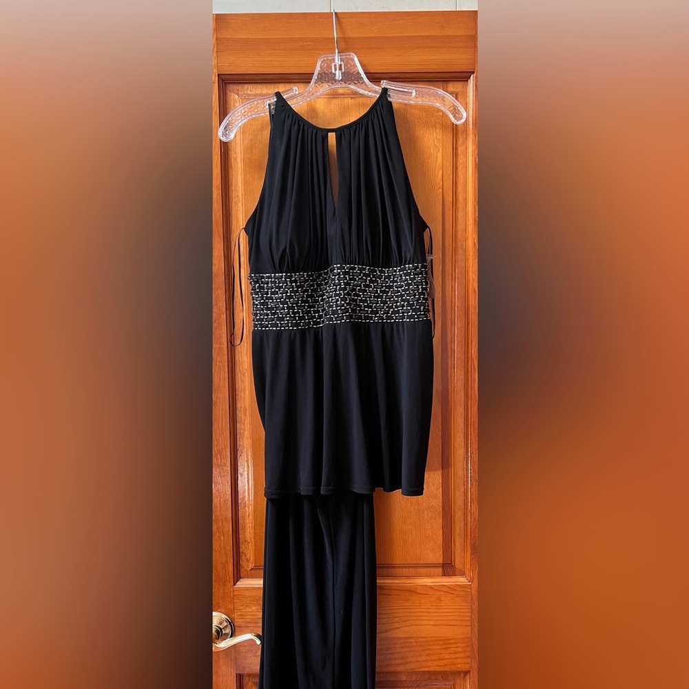 Pants suit with beaded waist.